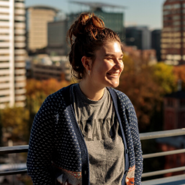 Student on the ASRC roof smiling