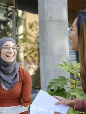 Students chatting outside coffee shop on Portland State campus