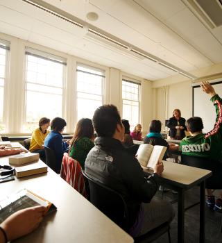 classroom with student raising hand
