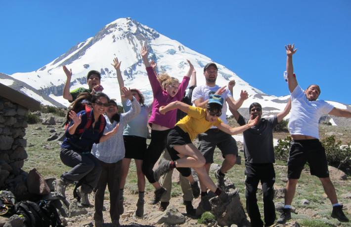 Group of hikers posing in front of Mount Hood