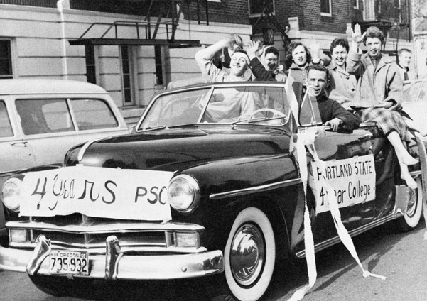 Students and supporters celebrate four-year college status with a six-block long cavalcade of cars. 1955