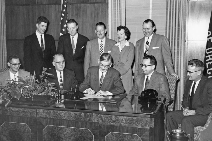 Gov. Paul Patterson signs legislation on Feb. 14, 1955 making Portland State a four-year college
