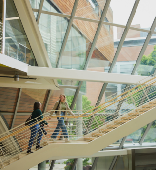 Students walking up stairs in Karl Miller Center